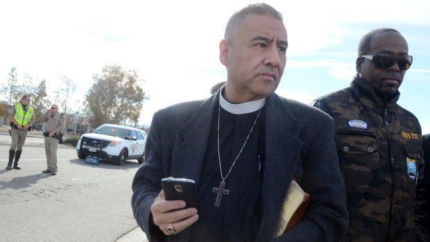 Juan Carlos Mendez gathers a group of pastors from area churches for a prayer vigil on Thursday in San Bernardino.