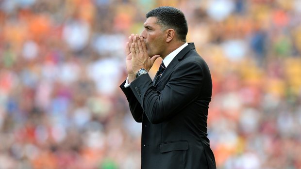 Coach John Aloisi of the Roar calls out instructions to his players.