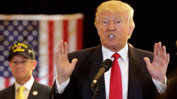 Republican presidential candidate Donald Trump answers questions during a news conference in New York. 