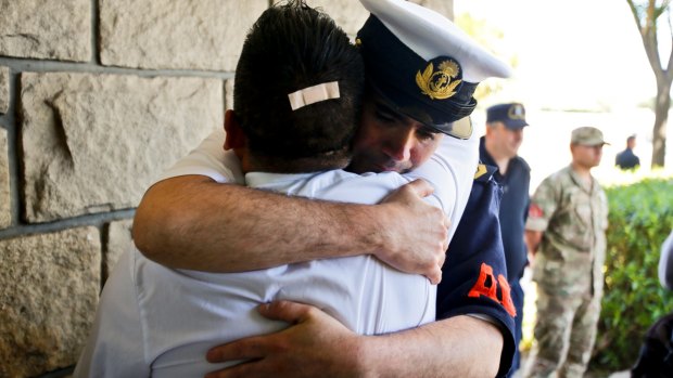 Argentine Navy officials embrace inside the Mar de Plata Naval Base last week.