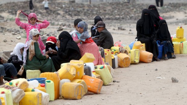 People line up to collect water from a public tap in Yemen's capital, Sanaa, a city in the grip of an acute water shortage, on Wednesday. 