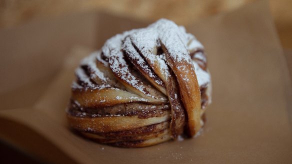 A layered morning bun ready for dipping into coffee.