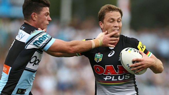 Hands on: Chad Townsend tackles Matt Moylan. 
