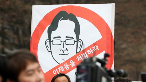 Protesters outside the Seoul Central District Court where Lee appeared in Janaury.  