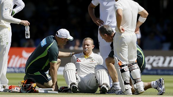 Concern: Australian batsman Chris Rogers sits on the ground before retiring on the fourth day of the Ashes Test at Lord's.