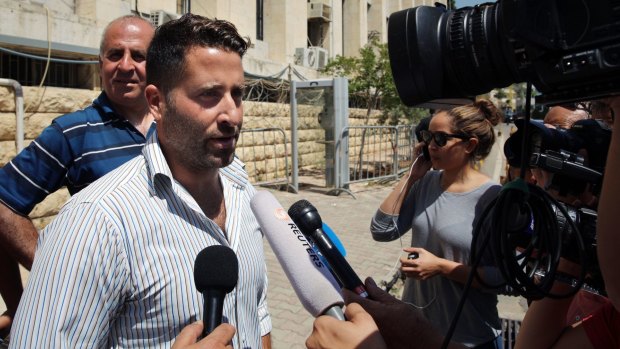 Lebanese father Ali Elamine speaks to journalists after dropping charges against his estranged wife and the <i>60 Minutes</i> crew.