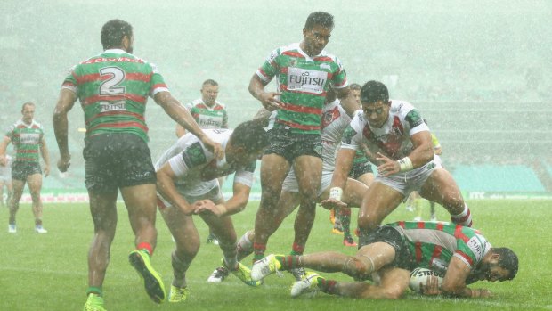 Torrential rain meant the match between Souths and the Dragons was tight and forward-driven. 