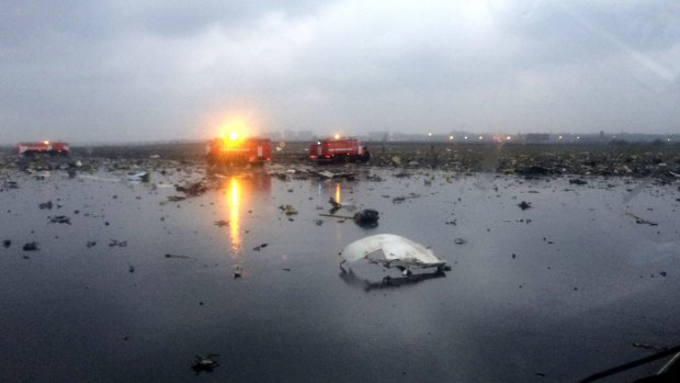 Russian emergency fire trucks are seen among the wreckage of a crashed plane at the Rostov-on-Don airport.