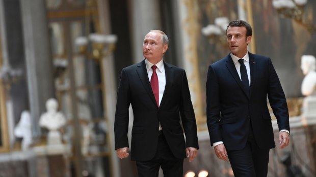 French President Emmanuel Macron and Vladimir Putin in the Galerie des Batailles at Versailles, France, last month.