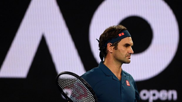 Roger Federer looks on during a break in the match against Stefanos Tsitsipas on day seven of the Australian Open in 2019.