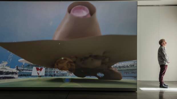A video exhibition at UTS Gallery shows the crowd's reaction at an AFL game as a 3D graph. 
