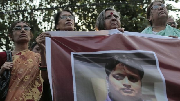 Bangladeshi social activists hold a banner displaying a portrait of blogger and author Ananta Bijoy Das during a protest against his killing, in Dhaka last year.