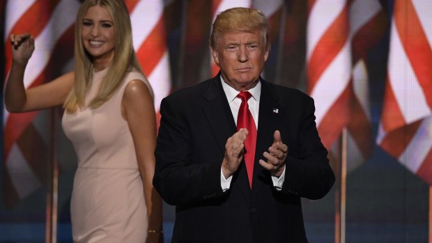 Donald Trump, 2016 Republican presidential nominee applauds as his daughter Ivanka Trump exits the stage.