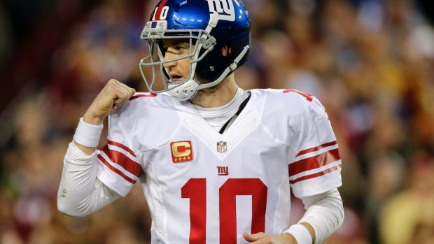 Up and down: New York Giants quarterback Eli Manning.