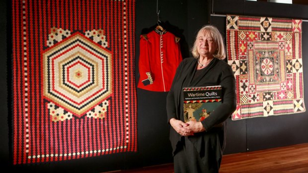 Historian Annette Gero with some of the wartime quilts on display at the Australasian Quilt Convention.