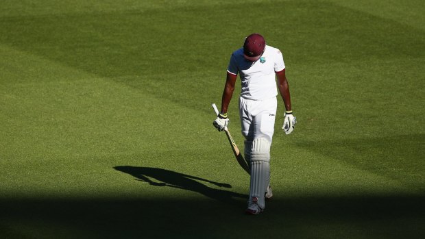 Stoic: Jason Holder trudges off after a fighting half-century.