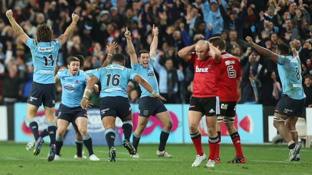 Glory days: The Waratahs celebrate victory and their first Super Rugby title.