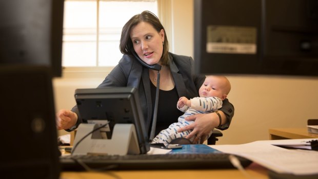 Kelly O'Dwyer at work with her son Edward in July.