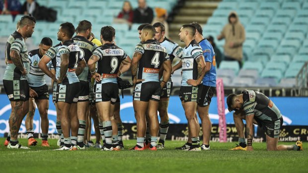 Beaten favourites: Sharks players show their dejection after conceding a try on full-time.