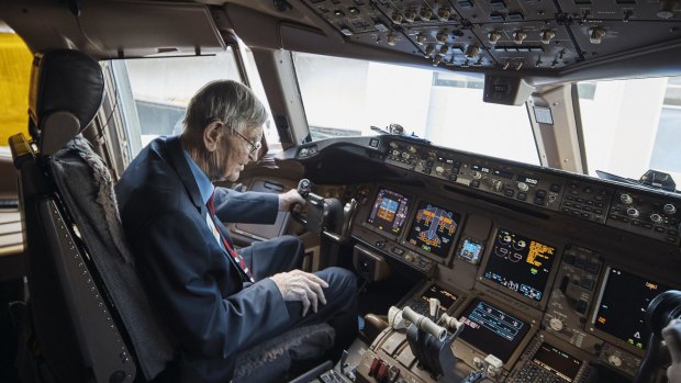 Frank Dell in the cockpit of the British Airways Boeing 777 at Sydney Airport.