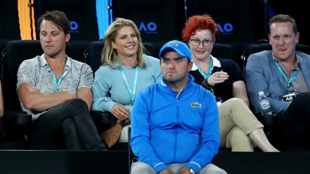 Singer Natalie Bassingthwaite (second from left) sitting on court for the match between Serena Williams and Lucie Safarova on Thursday.