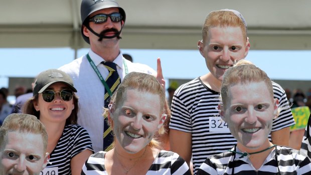 Fans wear Ben Stokes lookalike masks at the third Ashes Test in Perth. 