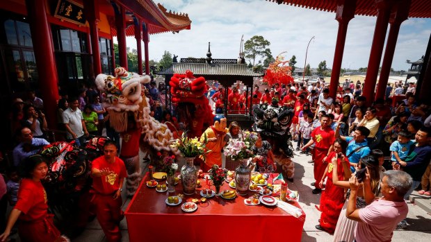 Food offerings and the lion dance for 2016 Lunar New Year celebrations at Bright Moon Buddhist temple in Springvale South. 