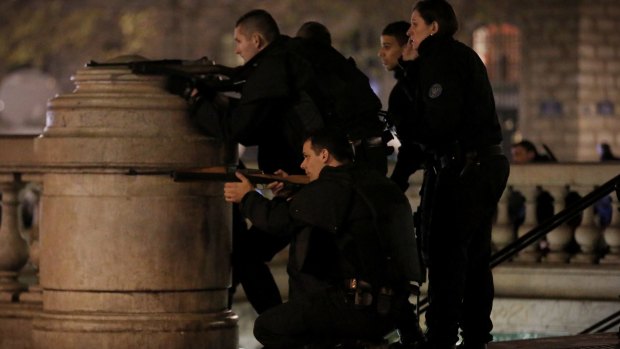 Police react to suspicious behaviour at Place de la Republique in Paris on Sunday.