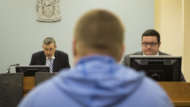 Magistrate Tony Parsons speaks to a drug court participant.
