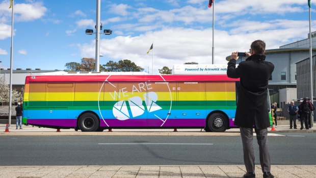 Compare the pair: one of the ACT government's rainbow buses for marriage equality.  