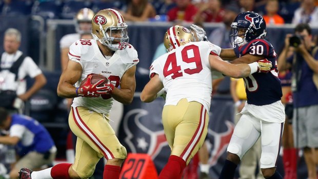 Cisco kid: Jarryd Hayne (left) rushes during a pre-season game with the San Francisco 49ers.
