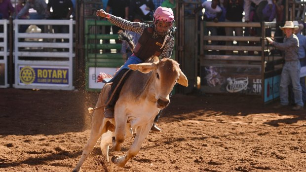 Ten-year-old Peter Gregory jnr competes in the poddy ride final at the Mount Isa Mines Rotary Rodeo.