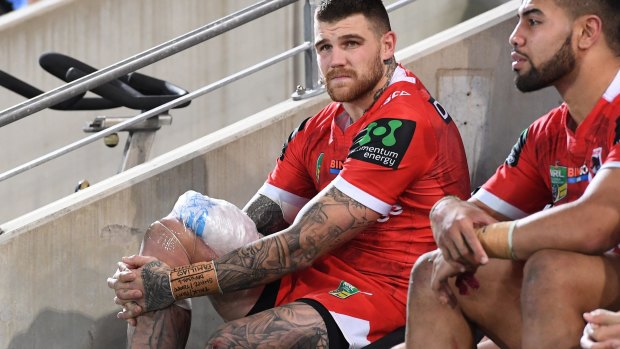 Scare: Josh Dugan ices his knee after coming off injured.