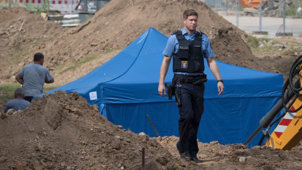 A police officer at the site where an unexploded bomb will be defused on Sunday in Frankfurt.