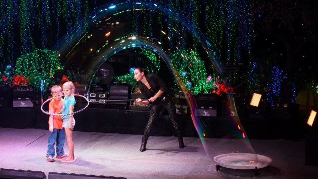 Yang creates bubbles within bubbles, and even puts lucky audience members inside a bubble. 