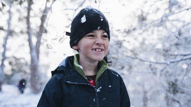 Samuel Bethune, 10, in the snow on Mt Ainslie.