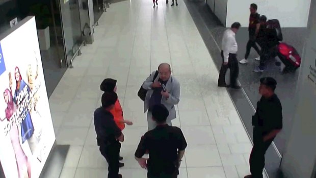 CCTV footage shows Kim Jong-nam speaking with Kuala Lumpur airport officials after the attack.