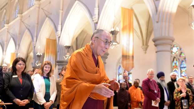 The Dalai Lama greeted guests before speaking at the Cathedral of St. Stephen.