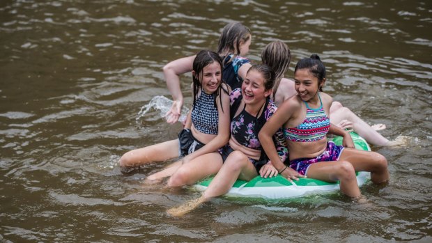 Canberrans cool off in summer heat at the Kambah pools.