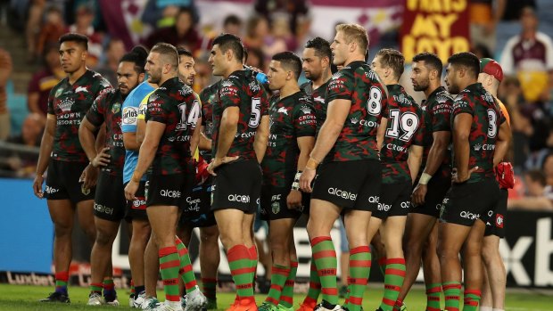 Dejected: Souths players come to terms with a tough defeat.