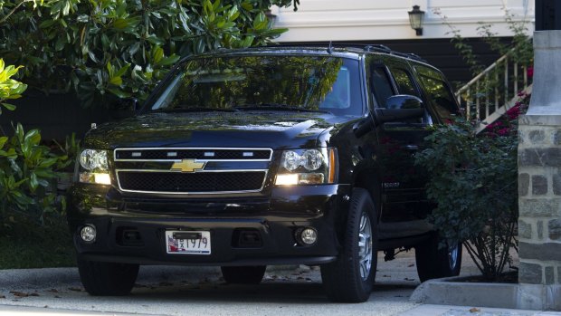 A SUV departs the Clinton's home in Washington on Saturday. 