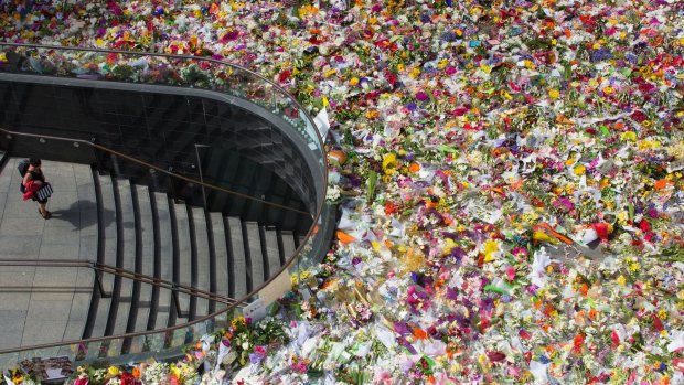 Inspiration: Flowers laid in tribute to the victims of the Sydney siege overwhelmed Martin Place.