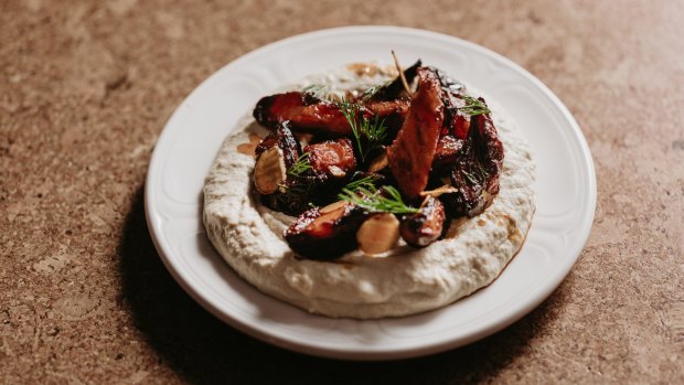 Meatless magic: warm hummus with maple-roasted carrots.