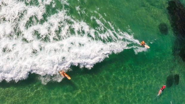 A shot of surfers at the the southern end of Bondi from a drone.
