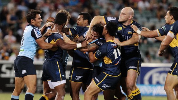 Handbags: Waratahs and Brumbies players get testy with each other in Canberra.