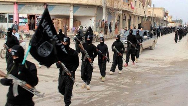 Islamic State march through Raqqa, Syria, in 2014. 