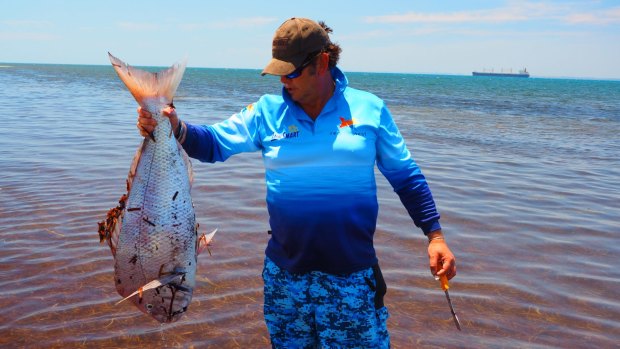 Recfishwest chief executive Andrew Rowland with a dead pink snapper at Cockburn Sound. 
