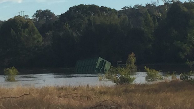 One of the two tanks dislodged by the floodwaters.