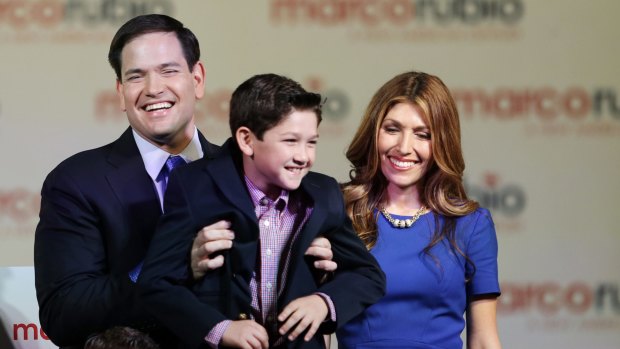 Marco Rubio holds up his son Anthony while his wife Jeanette looks on after announcing his run for the Republican presidential nomination. He is in many ways a traditional Republican.