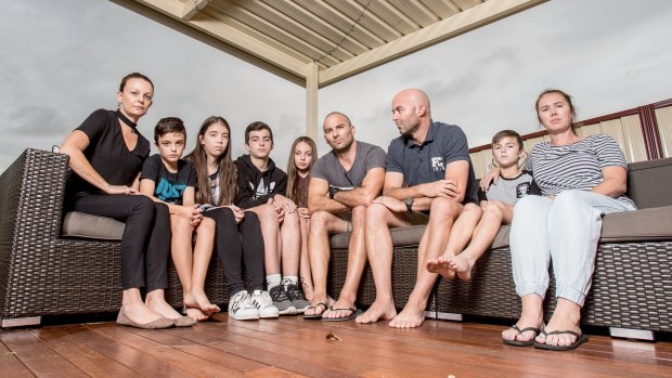 Brothers Craig and Cameron Zammit (pictured with their wives, Michelle and Belinda, and children) are taking up a fight to work flexible hours to help look after their children.